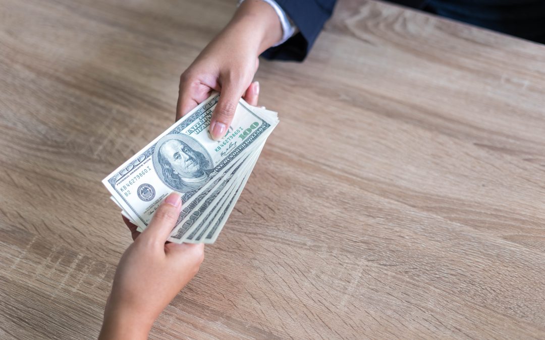 giving or paying money US dollar bill